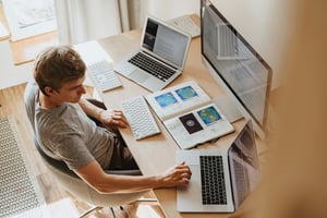 man working computers data analytics